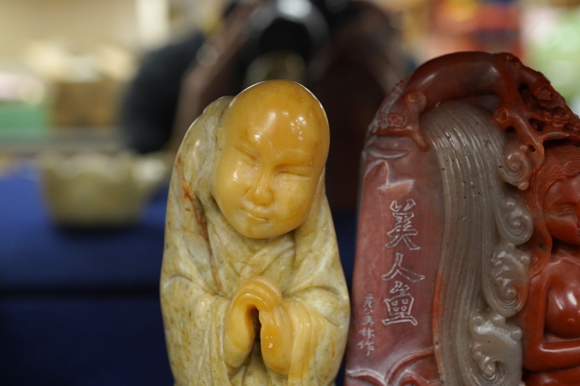 A Chinese white jade 'boys with jar' carving and three shoushan stone figures; luohan, girl with squirrel and mermaid (4), tallest 11cm